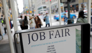 Signage for a job fair is seen on 5th Avenue in Manhattan, New York City, U.S., September 3, 2021. REUTERS/Andrew Kelly/File Photo