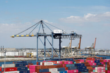 Shipping containers are stacked at a terminal at the port of Los Angeles in Long Beach, California, U.S., March 10, 2026. REUTERS/Caroline Brehman/File Photo