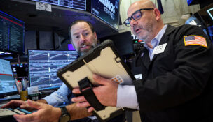 Traders work on the floor at the New York Stock Exchange (NYSE) in New York City, U.S., April 13, 2026. REUTERS/Brendan McDermid