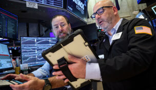 Traders work on the floor at the New York Stock Exchange (NYSE) in New York City, U.S., April 13, 2026. REUTERS/Brendan McDermid