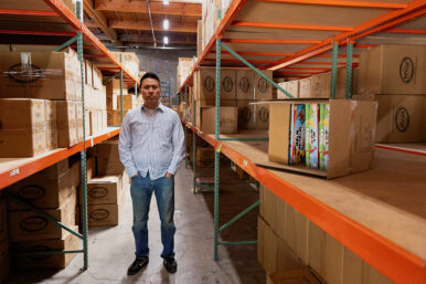 CEO Jason Cheung of toy manufacturer Huntar Company Inc poses amongst partially empty shelves at the U.S. office in Union City, California, U.S. May 8, 2025. REUTERS/Brittany Hosea-Small/File Photo