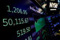 A screen displays the Dow Jones Industrial Average and other trading numbers following the closing bell at the New York Stock Exchange (NYSE) in New York City, U.S., February 6, 2026. REUTERS/Brendan McDermid/File Photo