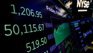 A screen displays the Dow Jones Industrial Average and other trading numbers following the closing bell at the New York Stock Exchange (NYSE) in New York City, U.S., February 6, 2026. REUTERS/Brendan McDermid/File Photo