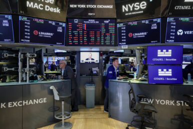 Traders work on the floor at the New York Stock Exchange (NYSE) in New York City, U.S., April 23, 2026. REUTERS/Jeenah Moon