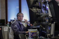 A trader works on the floor at the New York Stock Exchange (NYSE) in New York City, U.S., April 23, 2026. REUTERS/Jeenah Moon/File Photo