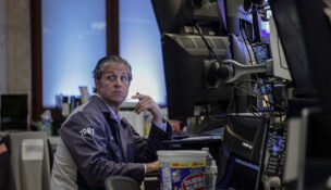A trader works on the floor at the New York Stock Exchange (NYSE) in New York City, U.S., April 23, 2026. REUTERS/Jeenah Moon/File Photo