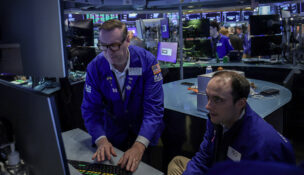 Traders work on the floor at the New York Stock Exchange (NYSE) in New York City, U.S., April 16, 2026. REUTERS/Jeenah Moon