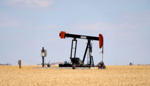An oil pumpjack is pictured in a farmer’s field near Kindersley, Saskatchewan, Canada September 5, 2024. REUTERS/Todd Korol
