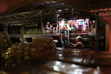 A person works at a grocery store inside Mercado Central, a marketplace of about 35 Latino‑owned small businesses in Minneapolis, Minnesota, U.S., February 12, 2026. REUTERS/Go Nakamura/File Photo