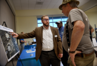 Western Virginia Water Authority’s Will Bulloss talked with Ron Lovern of Buchanan at a March open house. Photo by Natalee Waters