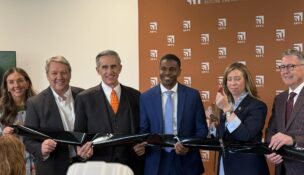 Secure Energy Future Center Managing Director Chelsea Olivieri, Hampton Roads Alliance President and CEO Doug Smith, Virginia Tech Board of Visitors Rector John Rocovich, Newport News Mayor Phillip Jones, Virginia Secretary of Commerce and Trade Carrie Chenery and Virginia Tech President Tim Sands hold a ribbon cutting to celebrate SEFC's opening. Photo by Josh Janney
