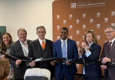 Secure Energy Future Center Managing Director Chelsea Olivieri, Hampton Roads Alliance President and CEO Doug Smith, Virginia Tech Board of Visitors Rector John Rocovich, Newport News Mayor Phillip Jones, Virginia Secretary of Commerce and Trade Carrie Chenery and Virginia Tech President Tim Sands hold a ribbon cutting to celebrate SEFC's opening. Photo by Josh Janney