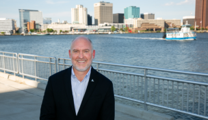 Portsmouth Economic Development Director Brian Donahue stands at the Crawford Bay site the city hopes to redevelop. Photo by Kristen Zeis