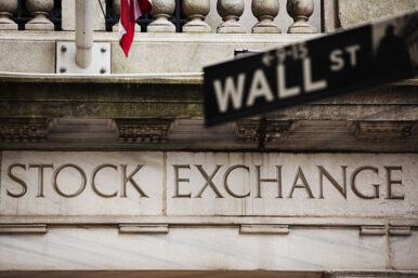 A street sign for Wall Street hangs in front of the New York Stock Exchange May 8, 2013. Stocks pushed further into record territory on Wednesday, driving the S&P 500 to an all-time high close for a fifth day, helped by strength in financials and technology. REUTERS/Lucas Jackson (UNITED STATES - Tags: BUSINESS)