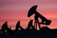 Sunset clouds glow over pump jacks at the Airankol oil field operated by Caspiy Neft in the Atyrau region, Kazakhstan, April 21, 2026. REUTERS/Pavel Mikheyev/File Photo