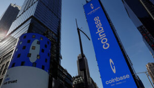 The logo for Coinbase Global Inc, the biggest U.S. cryptocurrency exchange, is displayed on the Nasdaq MarketSite jumbotron and others at Times Square in New York, U.S., April 14, 2021. REUTERS/Shannon Stapleton