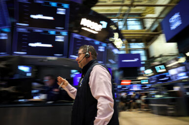 Traders work on the floor at the New York Stock Exchange (NYSE) in New York City, U.S., May 5, 2026. REUTERS/Brendan McDermid/File Photo