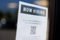 A "now hiring" sign is displayed on a local business after, U.S. employment growth slowed more than expected in July, in Encinitas, California, U.S. August 1, 2025. REUTERS/Mike Blake/File Photo