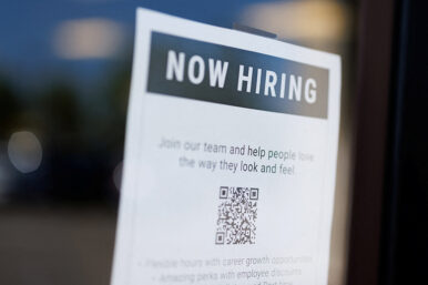 A "now hiring" sign is displayed on a local business after, U.S. employment growth slowed more than expected in July, in Encinitas, California, U.S. August 1, 2025. REUTERS/Mike Blake/File Photo