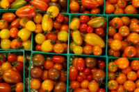 Tomatoes are displayed for sale at the Chino Farm in Rancho Santa Fe, after U.S. producer prices increased more than expected in July amid a surge in the costs of services and goods, in California, U.S., August 15, 2025. REUTERS/Mike Blake