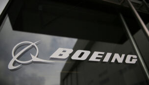 The Boeing logo on the doors to the Boeing factory in Renton, Washington, U.S., April 15, 2026. REUTERS/Genna Martin