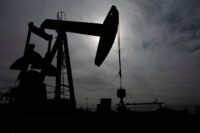 A pump jack operates near a crude oil reserve in the Permian Basin oil field near Midland, Texas, U.S. February 18, 2025. REUTERS/Eli Hartman/File Photo