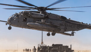 U.S. Marines with Combat Logistics Battalion 8, Combat Logistics Regiment 2, 2nd Marine Logistics Group and Marine Heavy Helicopter Squadron (HMH) 361, Marine Aircraft Group 16, 3rd Marine Air Wing, conduct a helicopter support team operation for the first evaluation of the air transportability of the Medium Range Air Defense Radar during Service Level Training Exercise 4-25 at the Marine Corps Air-Ground Combat Center, Twentynine Palms, California, on July 30, 2025. U.S. Marine Corps photo by Cpl. Judith Ann Lazaro