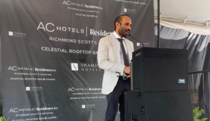 Neil Amin speaks at a groundbreaking celebration Monday. Photo courtesy Shamin Hotels