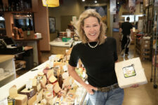The Cheese Shop co-owner Mary Ellen Power looks forward to a wave of new customers celebrating the nation’s 250th birthday. Photo by Jay Paul