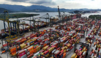 A drone view shows ships and containers at the Port of Santos, in Santos, Brazil April 3, 2025. REUTERS/Amanda Perobelli