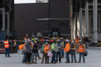 Workers leave a SpaceX construction site as the company prepares to file for an initial public offering (IPO), in Starbase, Texas, U.S., April 22, 2026. REUTERS/Carlos Barria/File Photo
