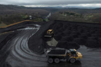 Workers transport and organise mounds of coal on a hilltop near an Arch Coal facility in Beckley, West Virginia, U.S., April 11, 2025. REUTERS/Adrees Latif/File Photo