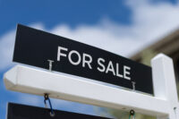 A for sale sign is shown in front of a single family home in Carlsbad, California, U.S., May, 13, 2026. REUTERS/Mike Blake