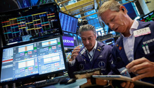 Traders work on the floor at the New York Stock Exchange (NYSE) in New York City, U.S., June 3, 2026. REUTERS/Brendan McDermid/File Photo
