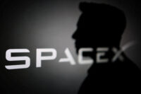 The silhouette of Elon Musk and SpaceX logo are seen in this illustration taken June 11, 2026. REUTERS/Dado Ruvic/Illustration