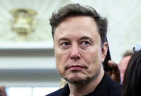 Elon Musk looks on as U.S. President Donald Trump meets South African President Cyril Ramaphosa in the Oval Office of the White House in Washington, D.C., U.S., May 21, 2025. REUTERS/Kevin Lamarque