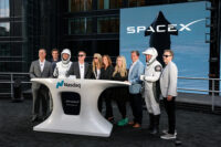 President and COO of SpaceX Gwynne Shotwell, SpaceX CFO and President of Strategic Acquisitions Bret Johnsen, SpaceX Vice President for Human Resources Brian Bjelde, Nasdaq CEO Adena Friedman and others pose on a balcony at the Nasdaq MarketSite after the closing bell, on the day of SpaceX's initial public offering (IPO), in New York City, U.S., June 12, 2026. REUTERS/Brendan McDermid/File Photo