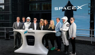 President and COO of SpaceX Gwynne Shotwell, SpaceX CFO and President of Strategic Acquisitions Bret Johnsen, SpaceX Vice President for Human Resources Brian Bjelde, Nasdaq CEO Adena Friedman and others pose on a balcony at the Nasdaq MarketSite after the closing bell, on the day of SpaceX's initial public offering (IPO), in New York City, U.S., June 12, 2026. REUTERS/Brendan McDermid/File Photo