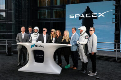 President and COO of SpaceX Gwynne Shotwell, SpaceX CFO and President of Strategic Acquisitions Bret Johnsen, SpaceX Vice President for Human Resources Brian Bjelde, Nasdaq CEO Adena Friedman and others pose on a balcony at the Nasdaq MarketSite after the closing bell, on the day of SpaceX's initial public offering (IPO), in New York City, U.S., June 12, 2026. REUTERS/Brendan McDermid/File Photo