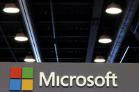 The logo of Microsoft is displayed over a booth at the Web Summit digital trade show in Vancouver, British Columbia, Canada, May 12, 2026. REUTERS/Chris Helgren/File Photo
