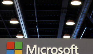 The logo of Microsoft is displayed over a booth at the Web Summit digital trade show in Vancouver, British Columbia, Canada, May 12, 2026. REUTERS/Chris Helgren/File Photo