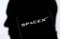 SpaceX logo and Elon Musk silhouette are seen in this illustration taken, December 19, 2022. REUTERS/Dado Ruvic/Illustration
