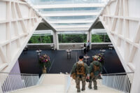 Secret Service police members walk down the stairs at Buergenstock Resort Lake Lucerne on the day of talks between the U.S., Iran, Pakistan, and Qatar at the Lake Lucerne Summit, aimed at advancing a deal to end the Middle East conflict, near Stansstad, Switzerland, June 21, 2026. REUTERS/Nathan Howard/Pool