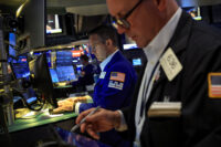 Traders work on the floor at the New York Stock Exchange (NYSE) in New York City, U.S., June 22, 2026. REUTERS/Brendan McDermid