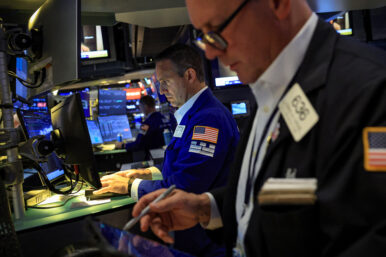 Traders work on the floor at the New York Stock Exchange (NYSE) in New York City, U.S., June 22, 2026. REUTERS/Brendan McDermid