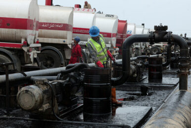 Men work during the unloading of oil from trucks arriving from Iraq at the Baniyas oil terminal, in Baniyas, Syria, May 14, 2026. REUTERS/Mahmoud Hassano/File Photo
