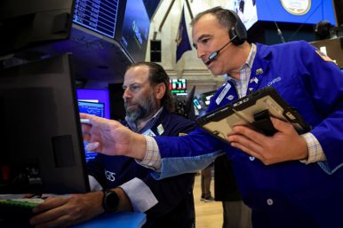 Traders work on the floor at the New York Stock Exchange (NYSE) in New York City, U.S., June 24, 2026. REUTERS/Brendan McDermid