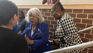 Virgnia Sen. Louise Lucas (left) speaks with an attendee of a Chesterfield County data center town hall she hosted June 16, 2026, with Sen. Mamie Locke (right). Photo by Kate Andrews/Virginia Business