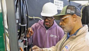 Instructor Kenneth Logan (right) works with marine electrician student Charles Livingston at Virginia Peninsula Community College’s Newport News Trades Center, which supports apprenticeship instruction. Photo courtesy Virginia Peninsula Community College