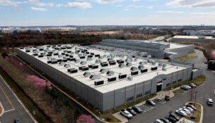 A car drives past a building of the Digital Realty Data Center in Ashburn, Virginia, U.S., March 17, 2025. REUTERS/Leah Millis/File Photo